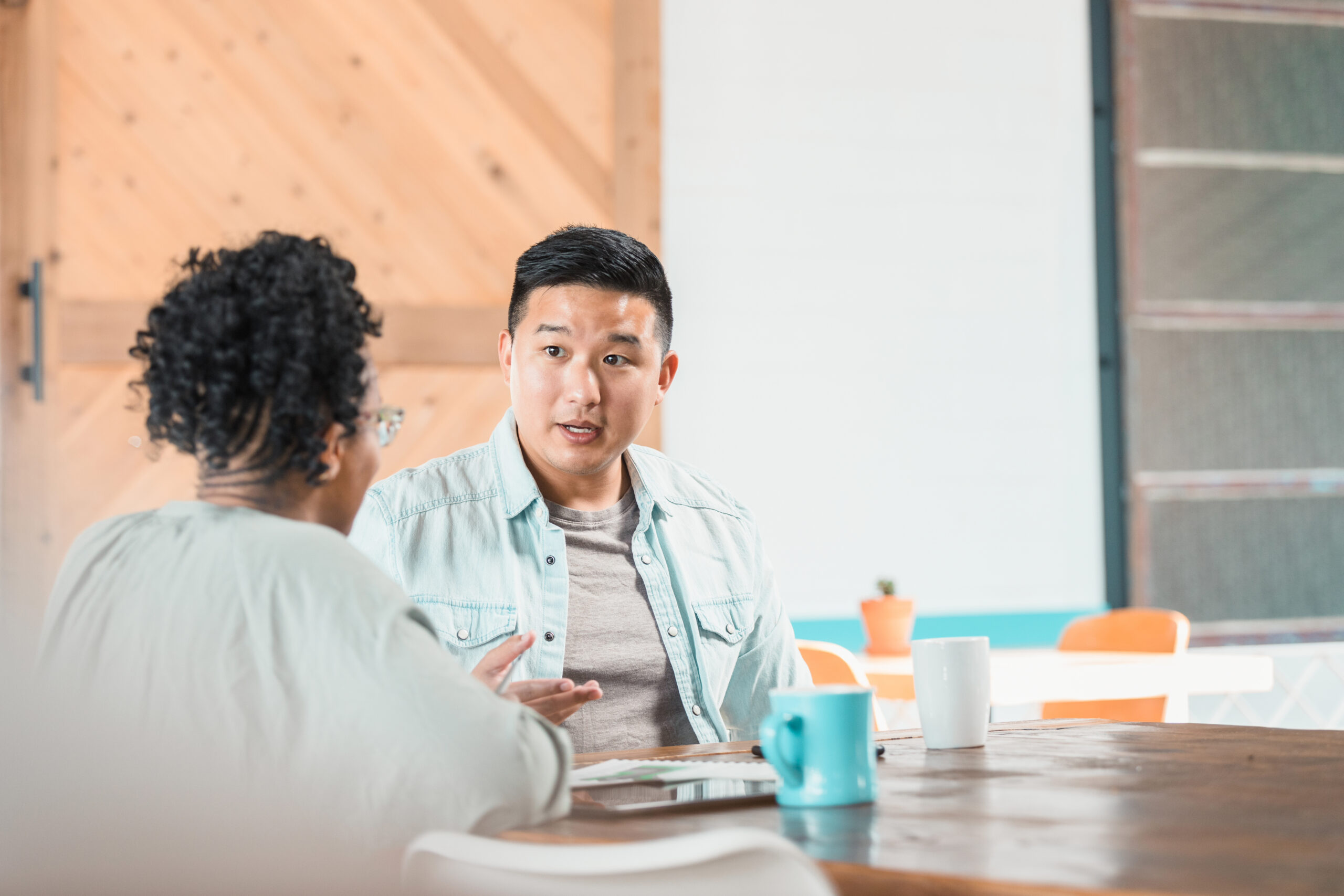 man and woman talking in a restaurant